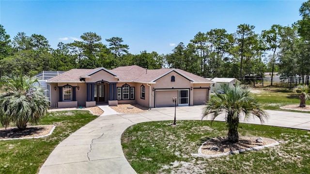 13110 Manistee Rd, Weeki Wachee, FL 34614 - single story home with stucco siding, driveway, a garage, and a front yard
