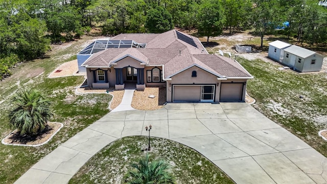 13110 Manistee Rd, Weeki Wachee, FL 34614 - ranch-style home featuring concrete driveway, a garage, stucco siding, a shingled roof, and a front yard