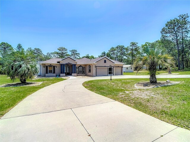 13110 Manistee Rd, Weeki Wachee, FL 34614 - single story home with driveway, a garage, a front lawn, and stucco siding