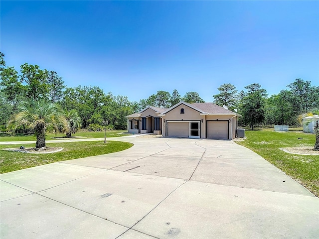 13110 Manistee Rd, Weeki Wachee, FL 34614 - single story home with an attached garage, driveway, and a front lawn