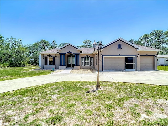 13110 Manistee Rd, Weeki Wachee, FL 34614 - single story home featuring concrete driveway, a garage, stucco siding, a front yard, and french doors