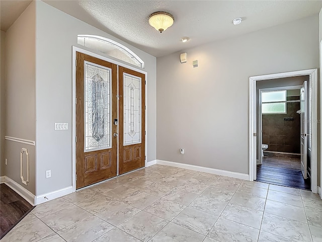 13110 Manistee Rd, Weeki Wachee, FL 34614 - entrance foyer featuring baseboards and french doors