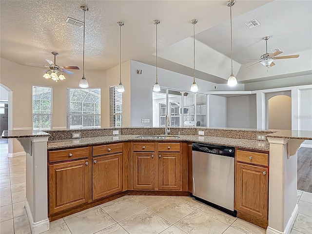13110 Manistee Rd, Weeki Wachee, FL 34614 - kitchen with a ceiling fan, dishwasher, a sink, arched walkways, and brown cabinetry