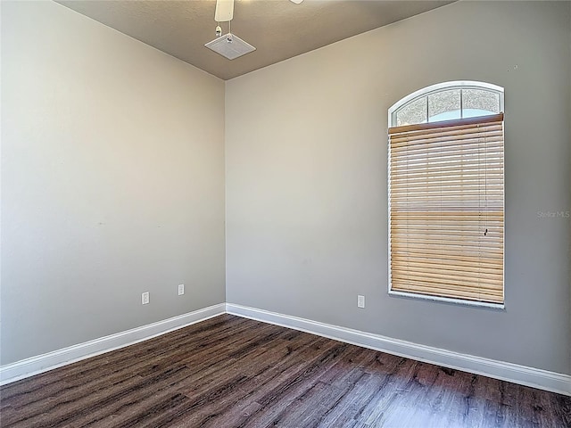 13110 Manistee Rd, Weeki Wachee, FL 34614 - spare room with dark wood-type flooring and baseboards