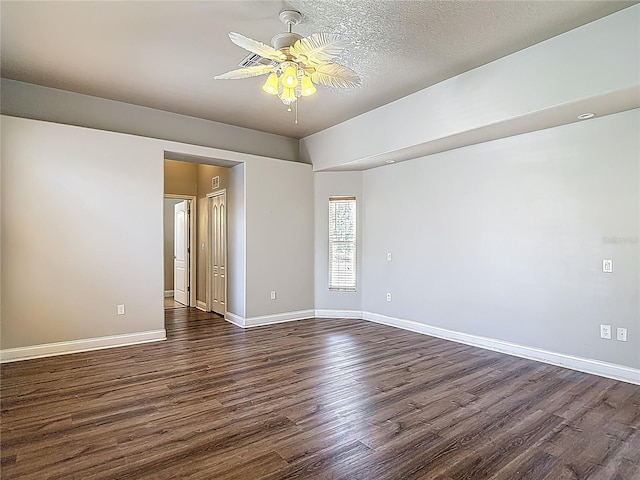 13110 Manistee Rd, Weeki Wachee, FL 34614 - unfurnished room with a ceiling fan, dark wood-style flooring, and baseboards