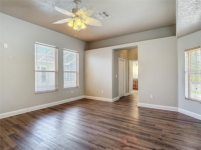 13110 Manistee Rd, Weeki Wachee, FL 34614 - empty room with ceiling fan, dark wood-style flooring, and baseboards