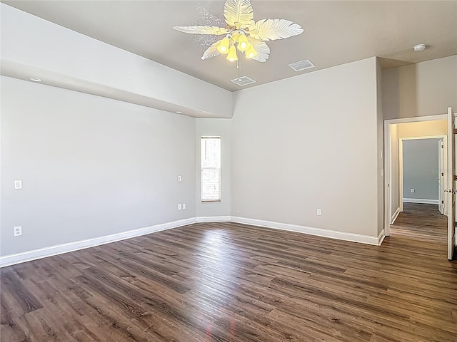 13110 Manistee Rd, Weeki Wachee, FL 34614 - unfurnished room with a ceiling fan, dark wood finished floors, and baseboards