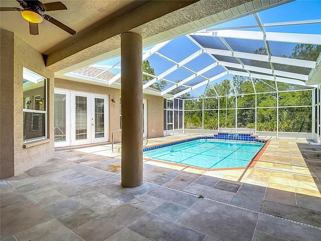 13110 Manistee Rd, Weeki Wachee, FL 34614 - swimming pool featuring french doors, a patio area, ceiling fan, and glass enclosure