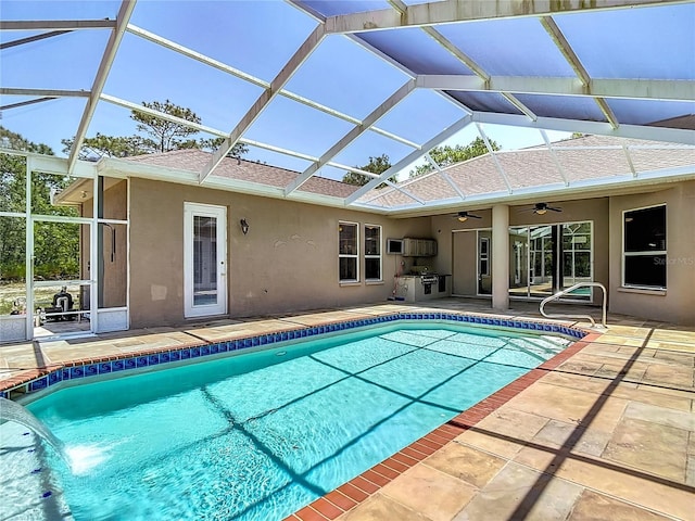 13110 Manistee Rd, Weeki Wachee, FL 34614 - outdoor pool featuring a ceiling fan, a patio, and glass enclosure