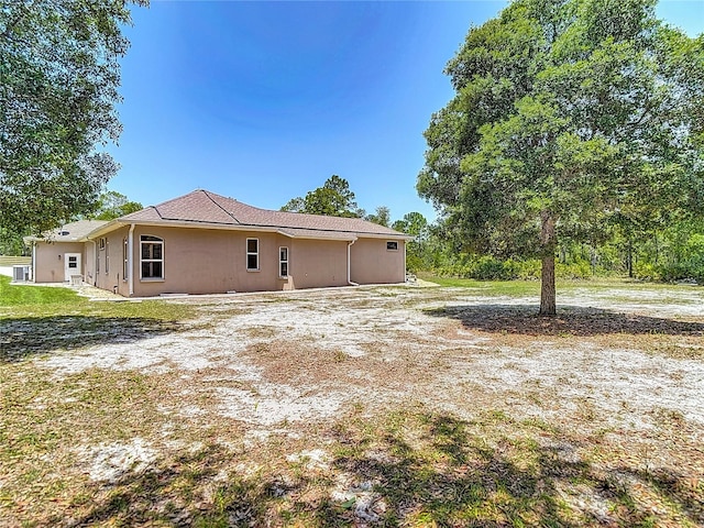 13110 Manistee Rd, Weeki Wachee, FL 34614 - view of property exterior featuring stucco siding