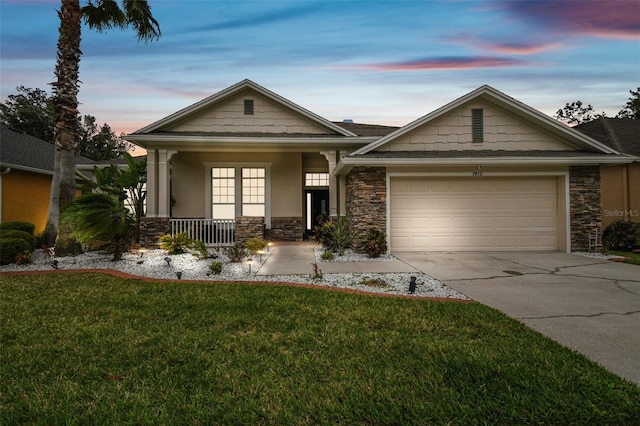 7410 Ambleside Dr, Land O Lakes, FL 34637 - craftsman house featuring stone siding, a porch, concrete driveway, a lawn, and a garage