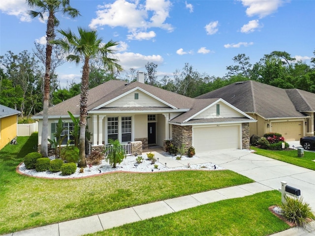 7410 Ambleside Dr, Land O Lakes, FL 34637 - craftsman-style home with covered porch, an attached garage, stone siding, concrete driveway, and a chimney