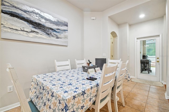 7410 Ambleside Dr, Land O Lakes, FL 34637 - dining area featuring light tile patterned floors and baseboards