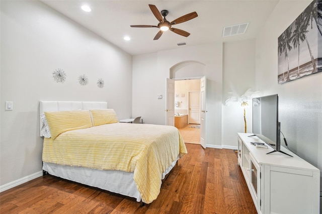 7410 Ambleside Dr, Land O Lakes, FL 34637 - bedroom featuring wood finished floors, baseboards, recessed lighting, ensuite bath, and a ceiling fan