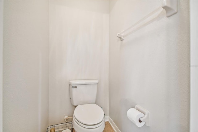 7410 Ambleside Dr, Land O Lakes, FL 34637 - bathroom featuring toilet, tile patterned flooring, and baseboards