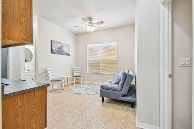 7410 Ambleside Dr, Land O Lakes, FL 34637 - living area featuring a ceiling fan and light tile patterned floors