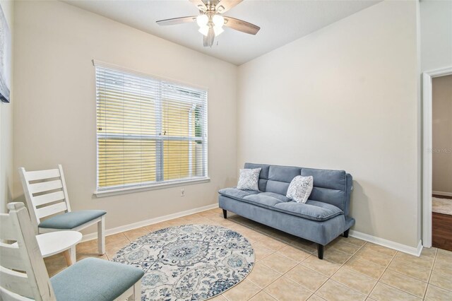 7410 Ambleside Dr, Land O Lakes, FL 34637 - sitting room featuring light tile patterned flooring, ceiling fan, and baseboards