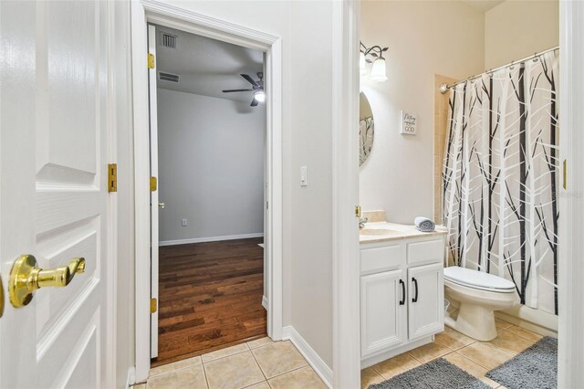 7410 Ambleside Dr, Land O Lakes, FL 34637 - bathroom with tile patterned floors, ceiling fan, toilet, and vanity