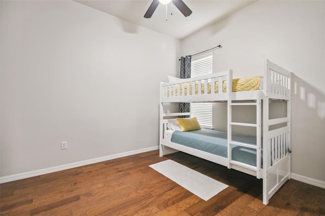 7410 Ambleside Dr, Land O Lakes, FL 34637 - bedroom with baseboards, wood finished floors, vaulted ceiling, and ceiling fan