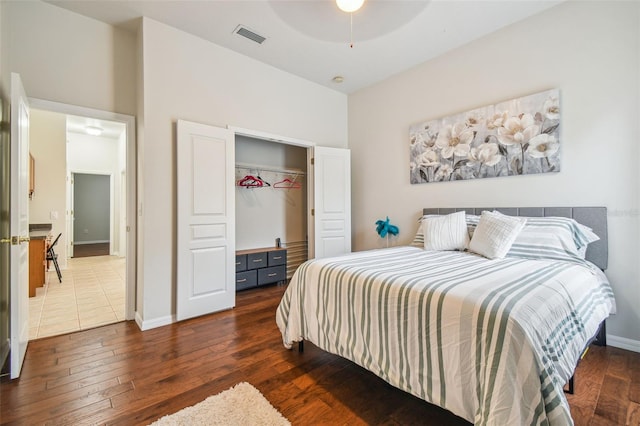 7410 Ambleside Dr, Land O Lakes, FL 34637 - bedroom with dark wood finished floors, a closet, and baseboards