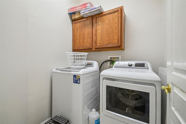 7410 Ambleside Dr, Land O Lakes, FL 34637 - laundry area with washing machine and dryer and cabinet space