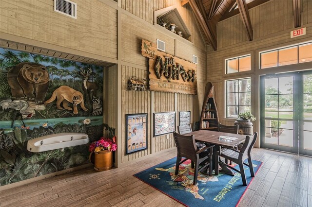 7410 Ambleside Dr, Land O Lakes, FL 34637 - dining space featuring high vaulted ceiling, beamed ceiling, wood ceiling, wood finished floors, and wooden walls
