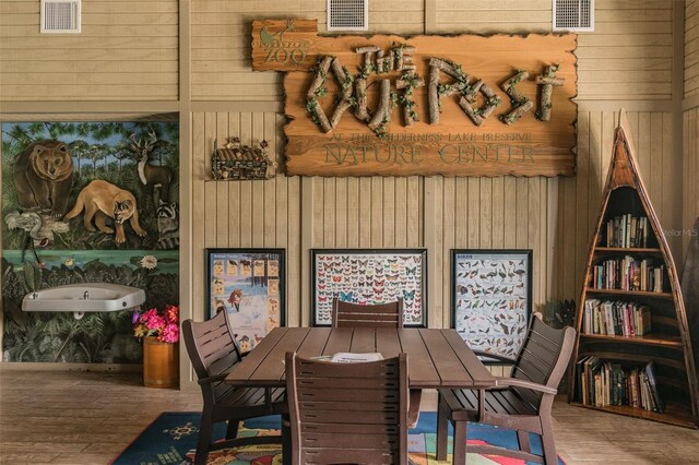 7410 Ambleside Dr, Land O Lakes, FL 34637 - dining area with wooden walls and wood finished floors
