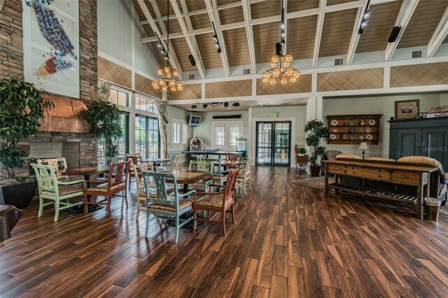 7410 Ambleside Dr, Land O Lakes, FL 34637 - dining room featuring a chandelier, high vaulted ceiling, wood finished floors, beamed ceiling, and rail lighting