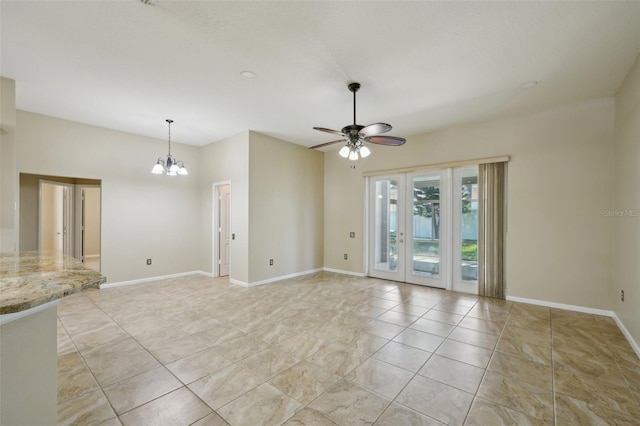 5340 Riva Ridge Dr, Wesley Chapel, FL 33544 - empty room featuring ceiling fan, light tile patterned flooring, a chandelier, and baseboards