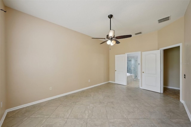 5340 Riva Ridge Dr, Wesley Chapel, FL 33544 - unfurnished bedroom with baseboards, ensuite bathroom, and a ceiling fan