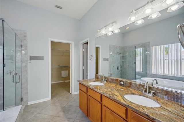 5340 Riva Ridge Dr, Wesley Chapel, FL 33544 - full bathroom with a stall shower, tile patterned floors, a garden tub, and double vanity
