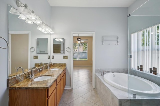 5340 Riva Ridge Dr, Wesley Chapel, FL 33544 - bathroom featuring a bath, double vanity, tile patterned floors, a ceiling fan, and baseboards