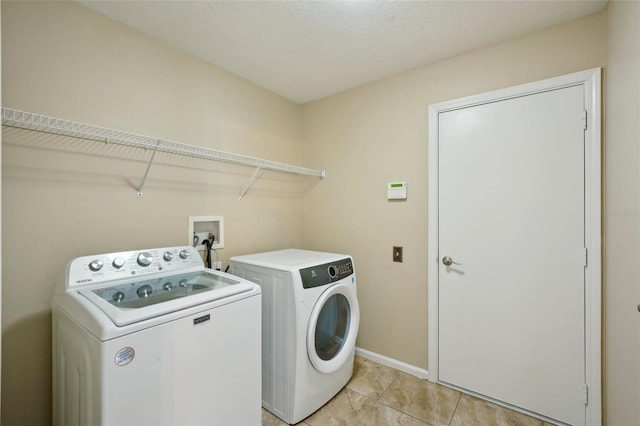 5340 Riva Ridge Dr, Wesley Chapel, FL 33544 - laundry room featuring separate washer and dryer, baseboards, and light tile patterned floors