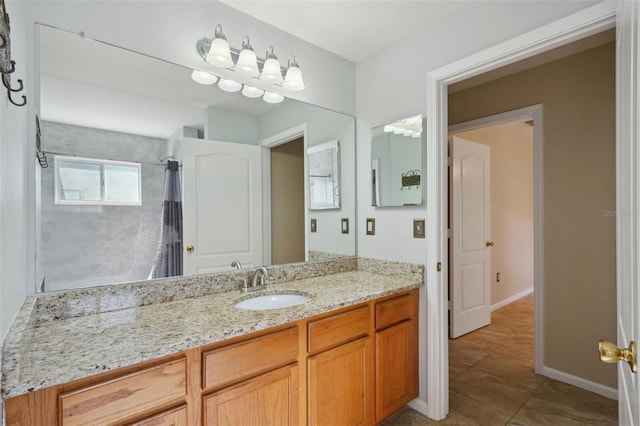 5340 Riva Ridge Dr, Wesley Chapel, FL 33544 - bathroom featuring vanity, tile patterned flooring, curtained shower, and baseboards