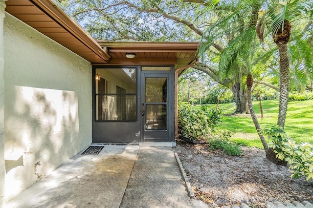 2150 Shelly Dr Unit D, Palm Harbor, FL 34684 - doorway to property with stucco siding