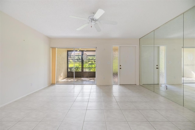 2150 Shelly Dr Unit D, Palm Harbor, FL 34684 - spare room featuring light tile patterned floors and ceiling fan