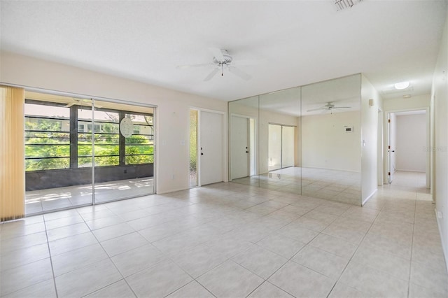 2150 Shelly Dr Unit D, Palm Harbor, FL 34684 - empty room featuring a ceiling fan and light tile patterned floors