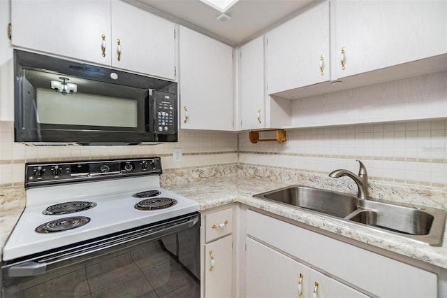 2150 Shelly Dr Unit D, Palm Harbor, FL 34684 - kitchen with electric stove, black microwave, a sink, tasteful backsplash, and light countertops