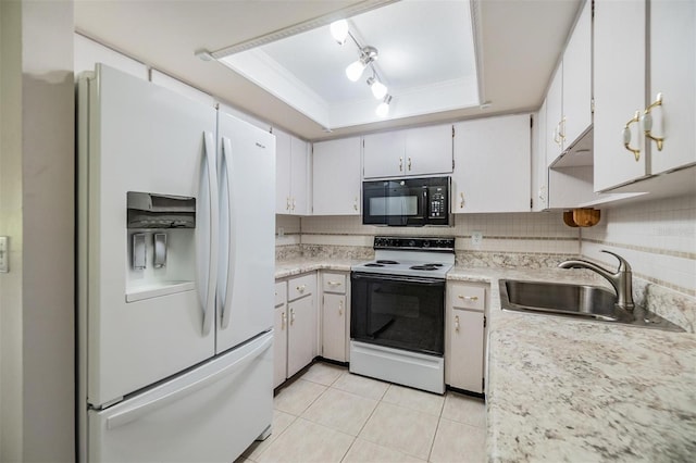 2150 Shelly Dr Unit D, Palm Harbor, FL 34684 - kitchen with white fridge with ice dispenser, black microwave, electric range oven, a tray ceiling, and a sink