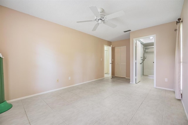 2150 Shelly Dr Unit D, Palm Harbor, FL 34684 - unfurnished bedroom with baseboards, light tile patterned floors, and ceiling fan