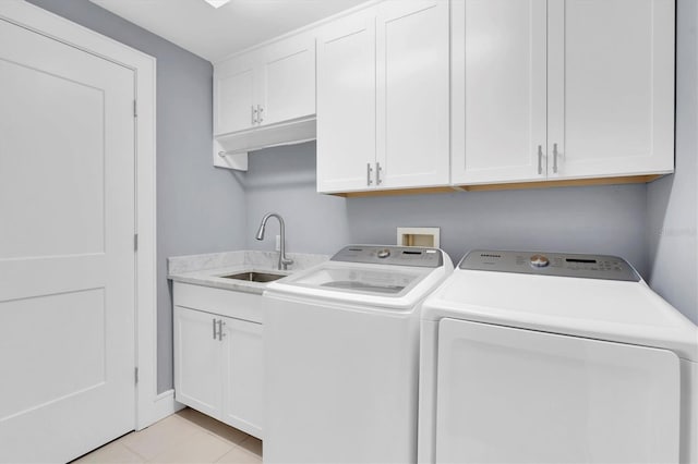 555 5th Ave NE Unit 1032, Saint Petersburg, FL 33701 - laundry area featuring washing machine and dryer, cabinet space, and light tile patterned floors