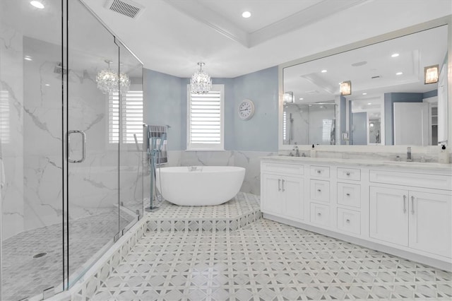 555 5th Ave NE Unit 1032, Saint Petersburg, FL 33701 - bathroom with a chandelier, a marble finish shower, double vanity, a tray ceiling, and a freestanding bath