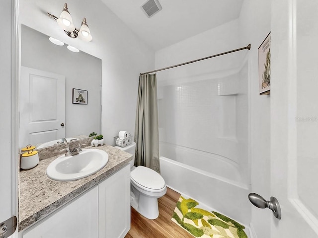 35552 Shade Fern Ln, Zephyrhills, FL 33541 - full bath with vanity, shower / bath combination with curtain, wood finished floors, and toilet