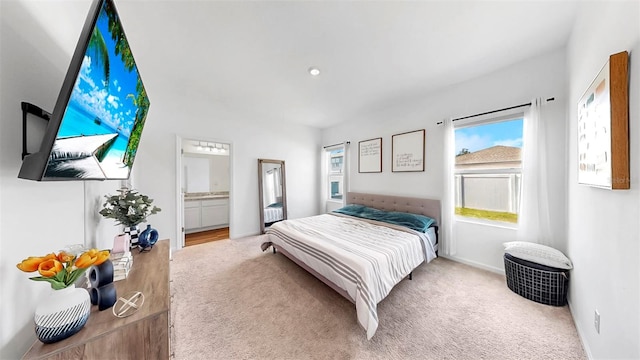 35552 Shade Fern Ln, Zephyrhills, FL 33541 - bedroom with carpet, connected bathroom, and baseboards