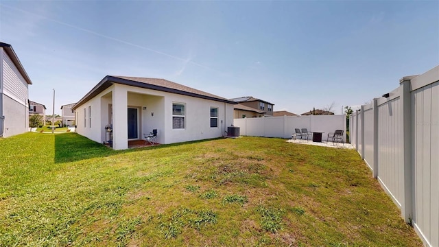 35552 Shade Fern Ln, Zephyrhills, FL 33541 - rear view of house with cooling unit, stucco siding, and a patio