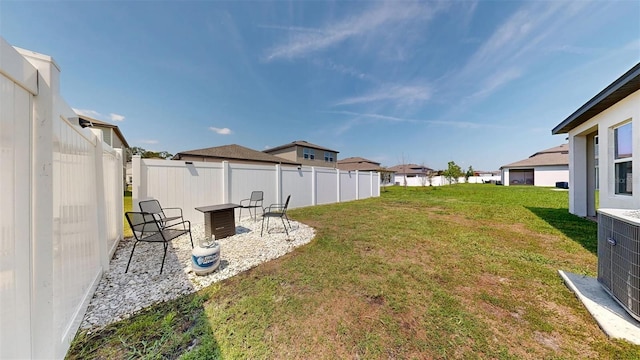 35552 Shade Fern Ln, Zephyrhills, FL 33541 - view of yard featuring a residential view, central AC unit, and a patio area