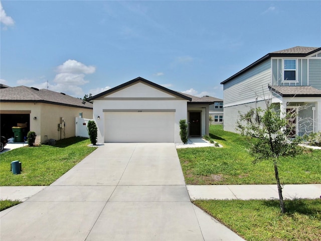 35552 Shade Fern Ln, Zephyrhills, FL 33541 - view of front facade featuring a front lawn, a garage, and concrete driveway