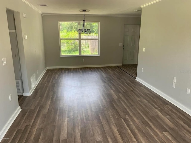 808 Hillsdale Dr, Cocoa, FL 32922 - unfurnished dining area featuring crown molding, a chandelier, baseboards, and dark wood-type flooring