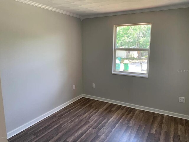 808 Hillsdale Dr, Cocoa, FL 32922 - empty room with dark wood-style floors, baseboards, and crown molding