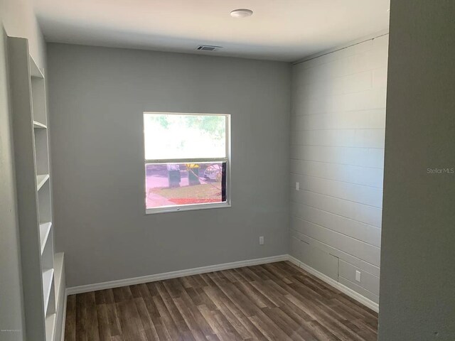 808 Hillsdale Dr, Cocoa, FL 32922 - unfurnished room with dark wood-style flooring and baseboards